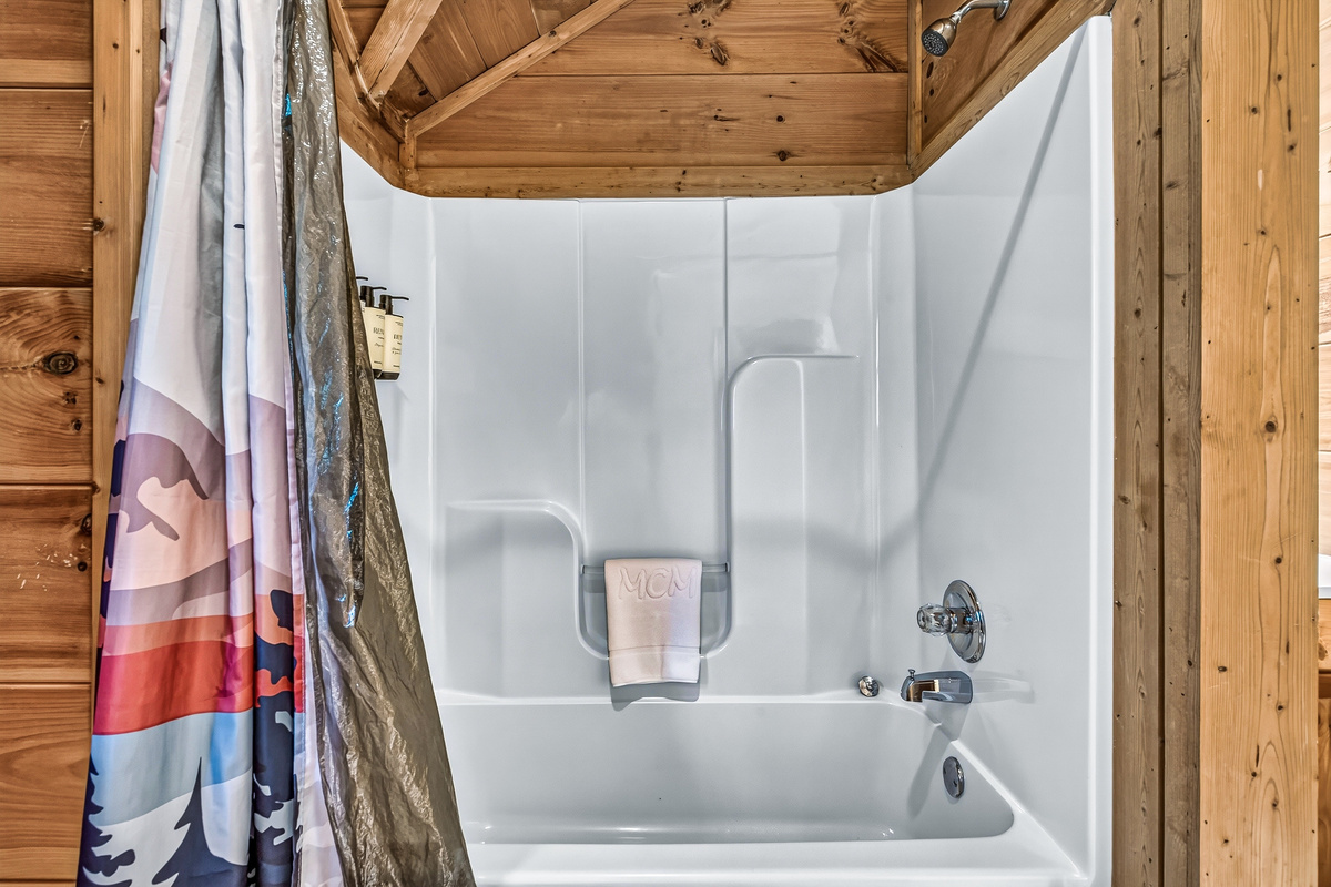 Enjoy a quick shower or a warm bath in this spotless shower and tub combo.