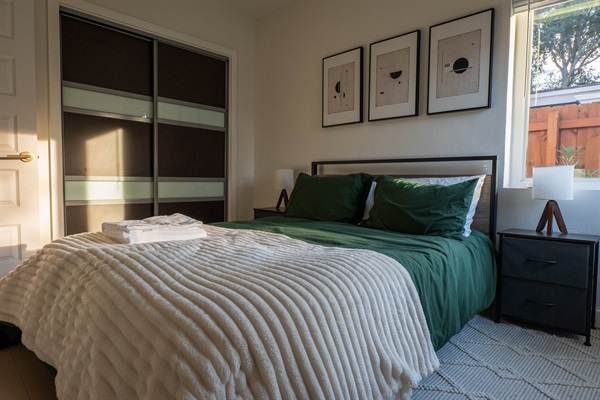 Simple guest room with smooth textures and balanced decor