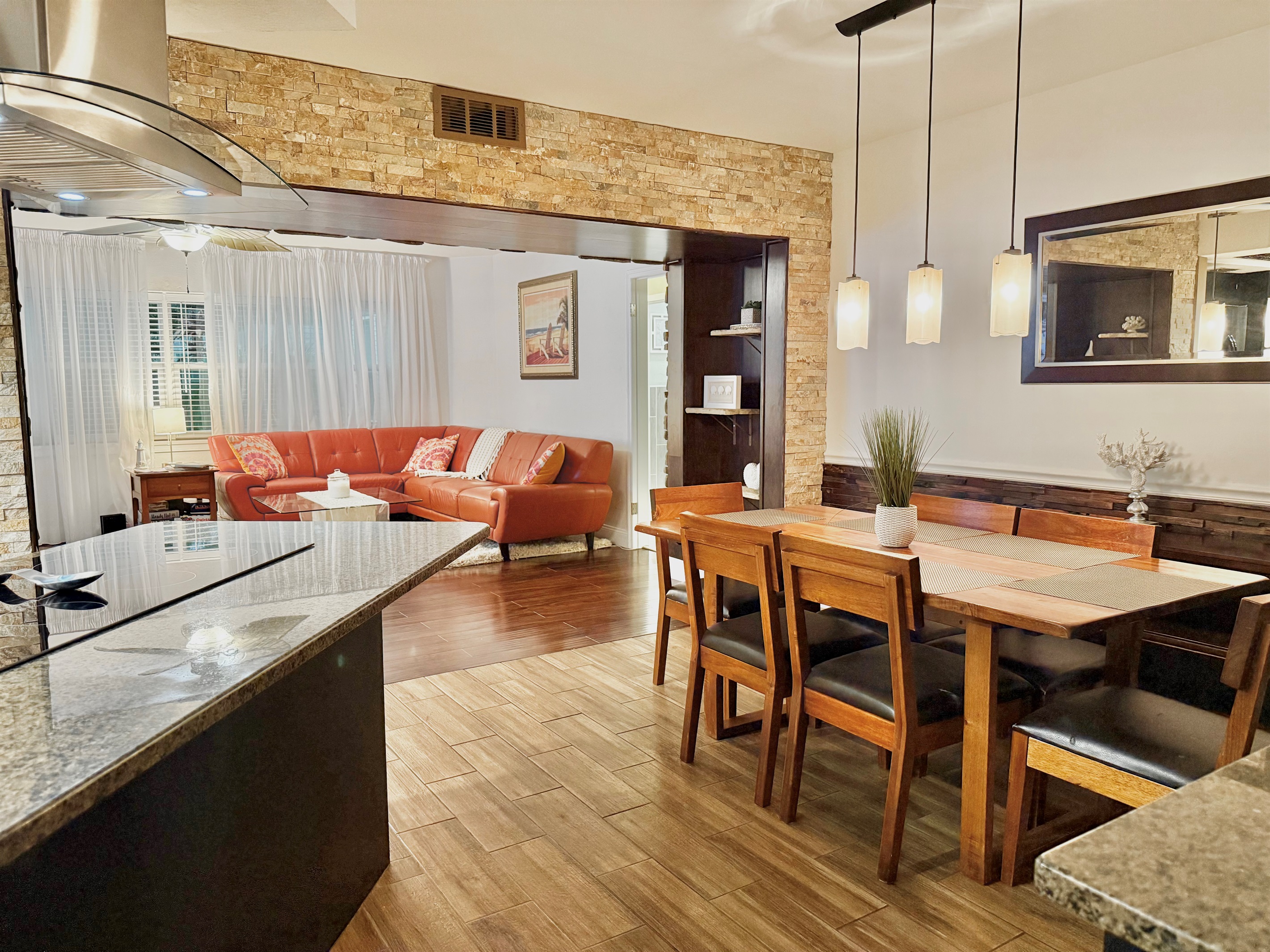 Simple yet refined, this dining space balances clean lines and warm wood elements, offering a relaxed and uncluttered place to dine or work.
