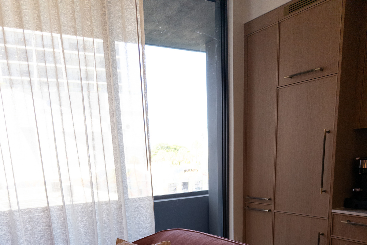 Floor-to-ceiling windows pour natural light across the studio all day long.