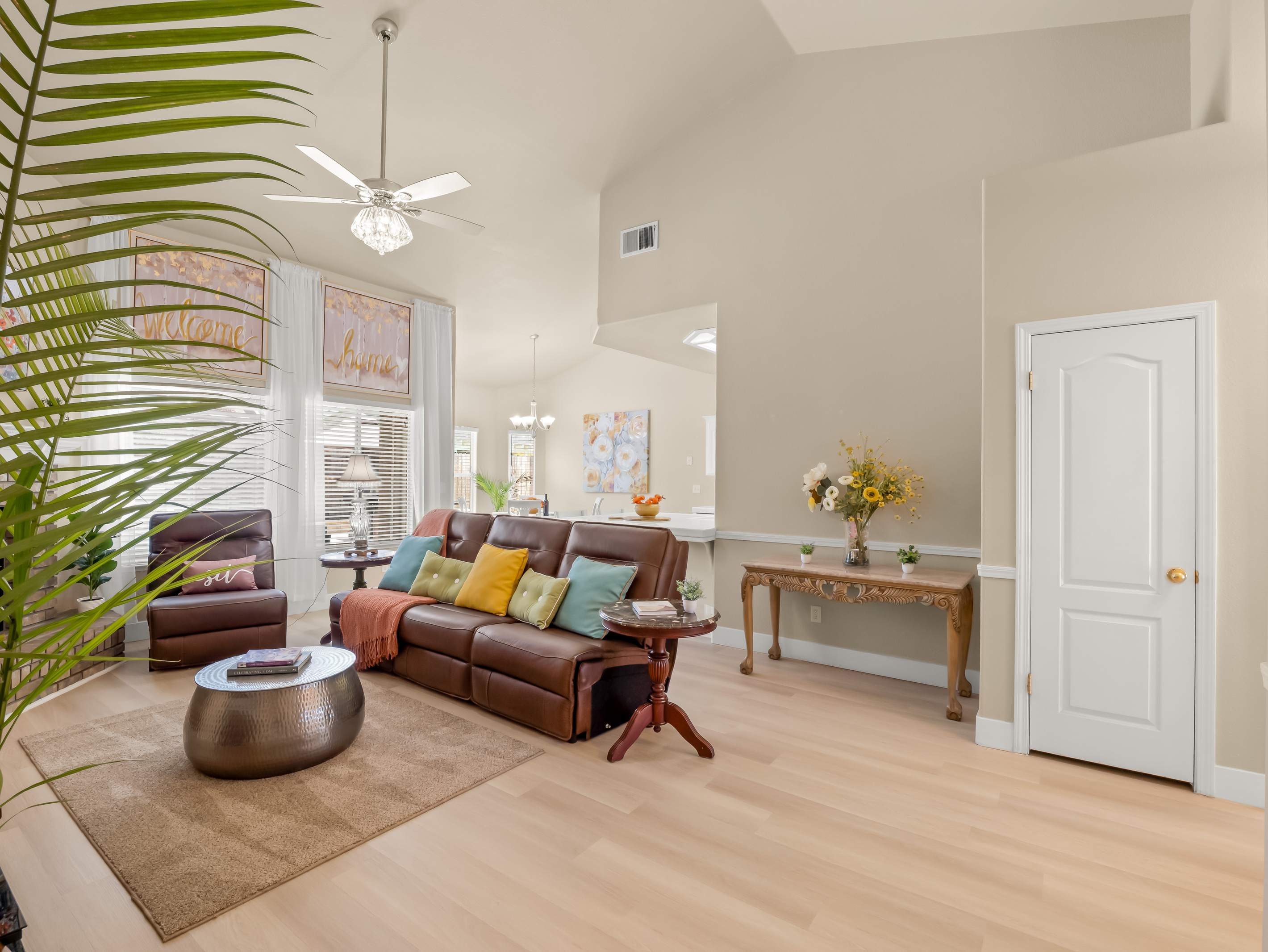 The heart of the home features an open and inviting living space with vaulted ceilings, comfortable reclining seating, and plenty of room to gather.