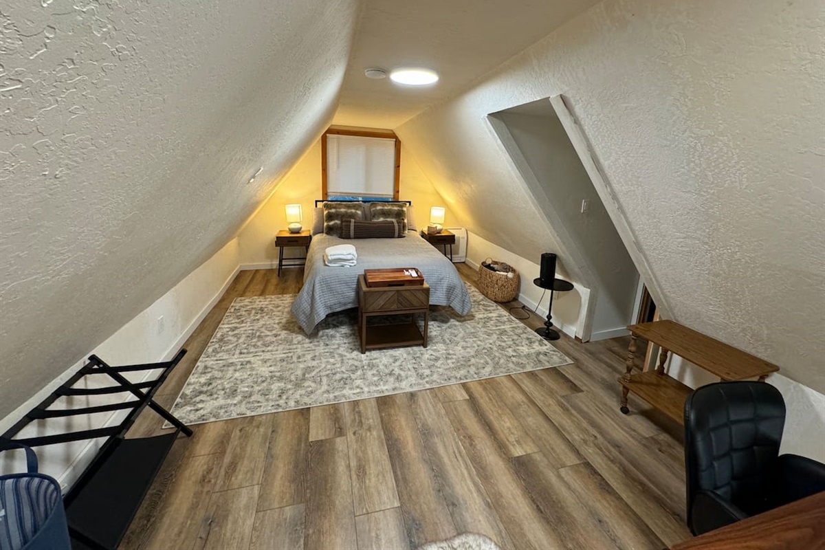 This loft space is just outside the upstairs bedroom and features a comfortable mattress, separate thermostat and extra blankets. 