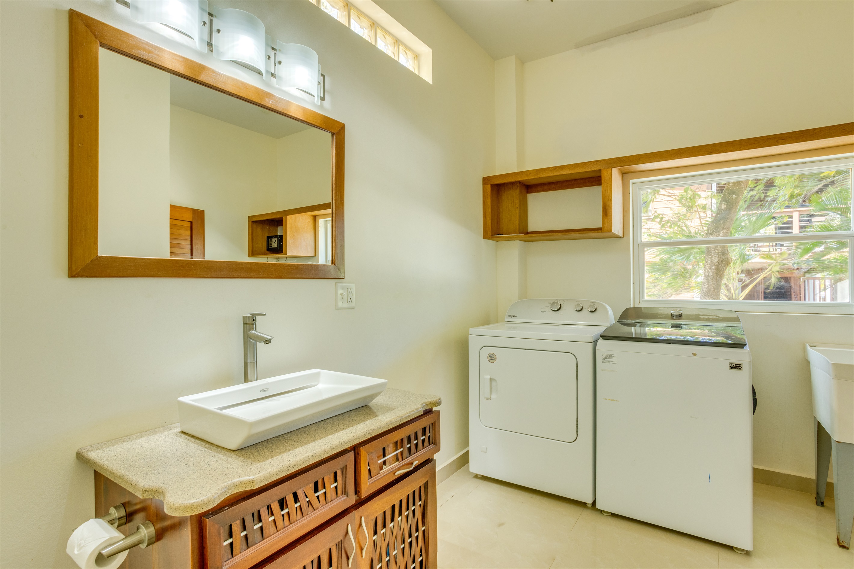First floor half bathroom with laundry room