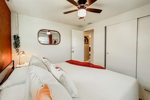 Master Bedroom with King Size Bed, Night Stands, Lamps/charging ports, Local Artist Mural, 4 King Sized Pillows, Mirror, Table Top Fan for White Noise, Iron, Ironing Board, Luggage Rack & More
