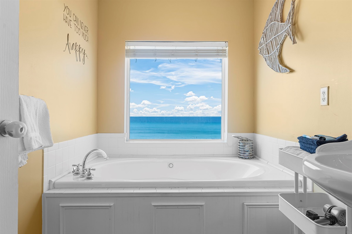 Upstairs master bedroom (2nd floor): King bed + private balcony + ensuite with Jacuzzi tub. Waking up to that view is everything.