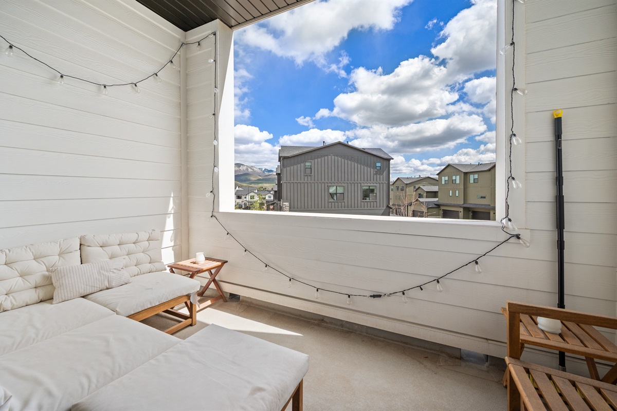 Covered outdoor lounge area—perfect for morning coffee or evening relaxation.
