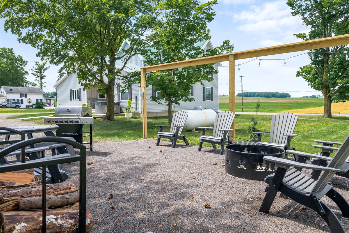 Picturesque grilling and dining zone with stunning views of the rolling fields