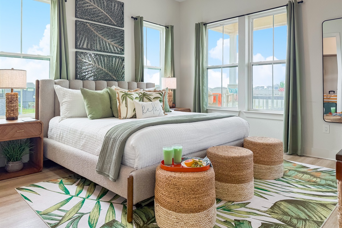 The primary suite upstairs is the Moody Gardens Suite.