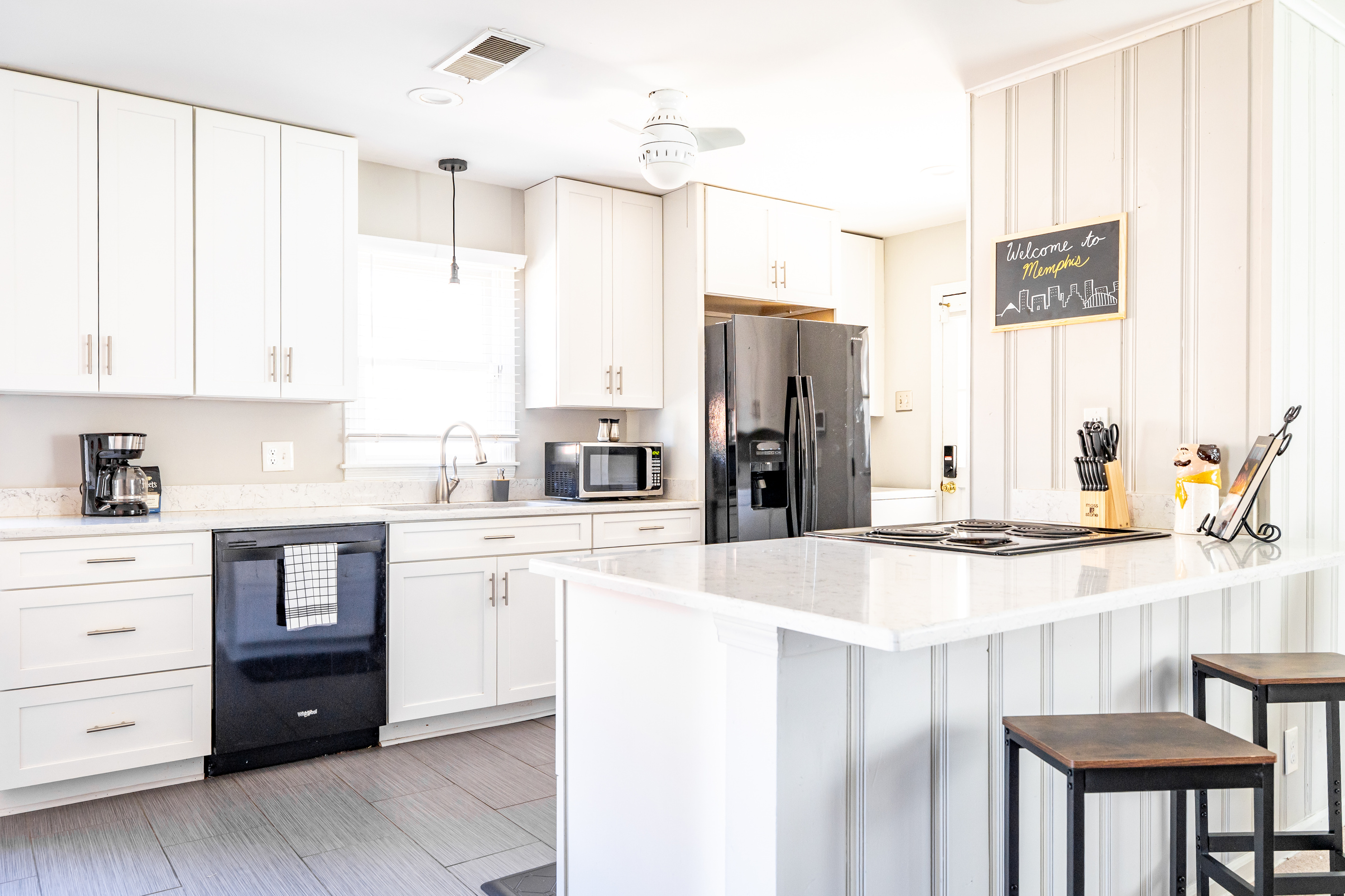 Fully equipped kitchen with refrigerator, stove, oven, microwave, dish washer.