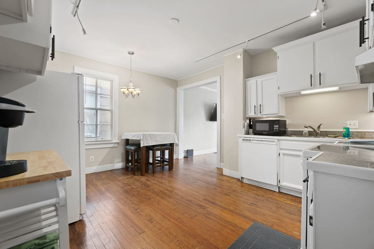 Open and inviting view of the kitchen and dining area, seamlessly connected to create a spacious, functional space perfect for cooking, dining, and entertaining.
