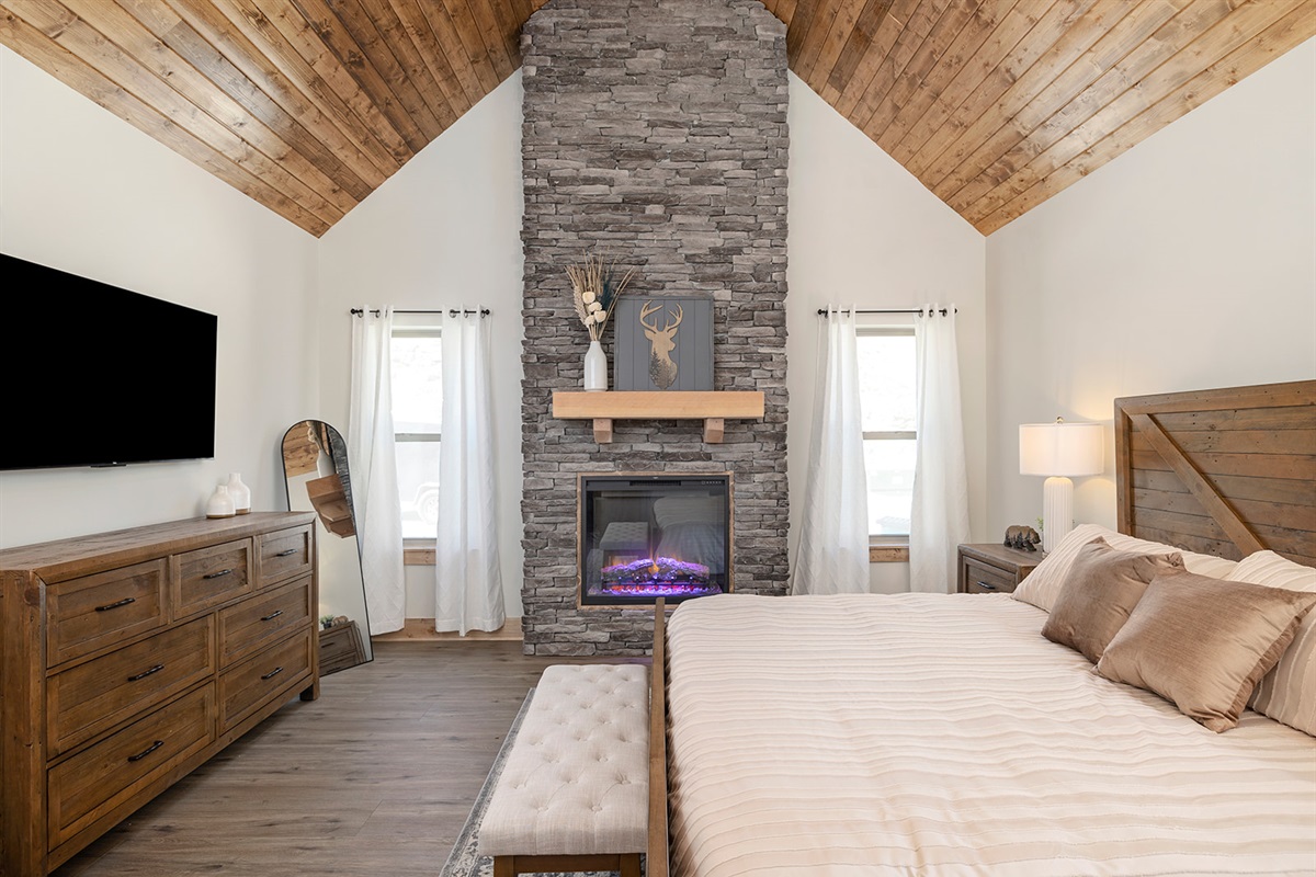 Main level master suite! Kind bed with a fireplace and ensuite bath!