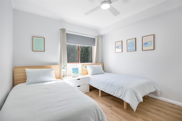 Bedroom Two - 2 king single beds & built-in wardrobe. All bed linen provided.