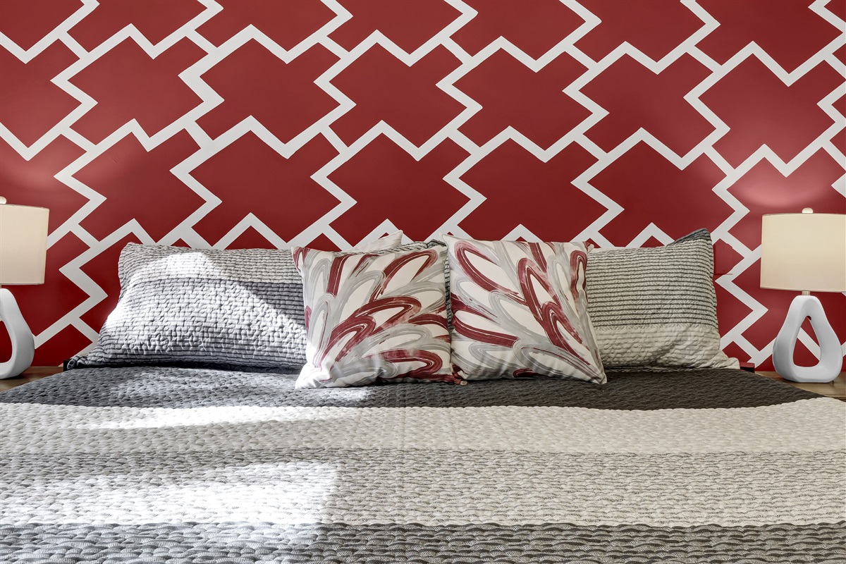 Immerse yourself in this professionally decorated room featuring Wolfpack colors.