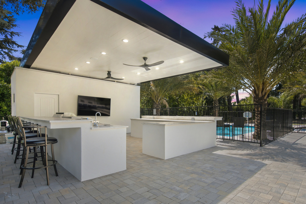 Opens directly into the bright dining space, offering ample seating and peaceful views of the outdoors.