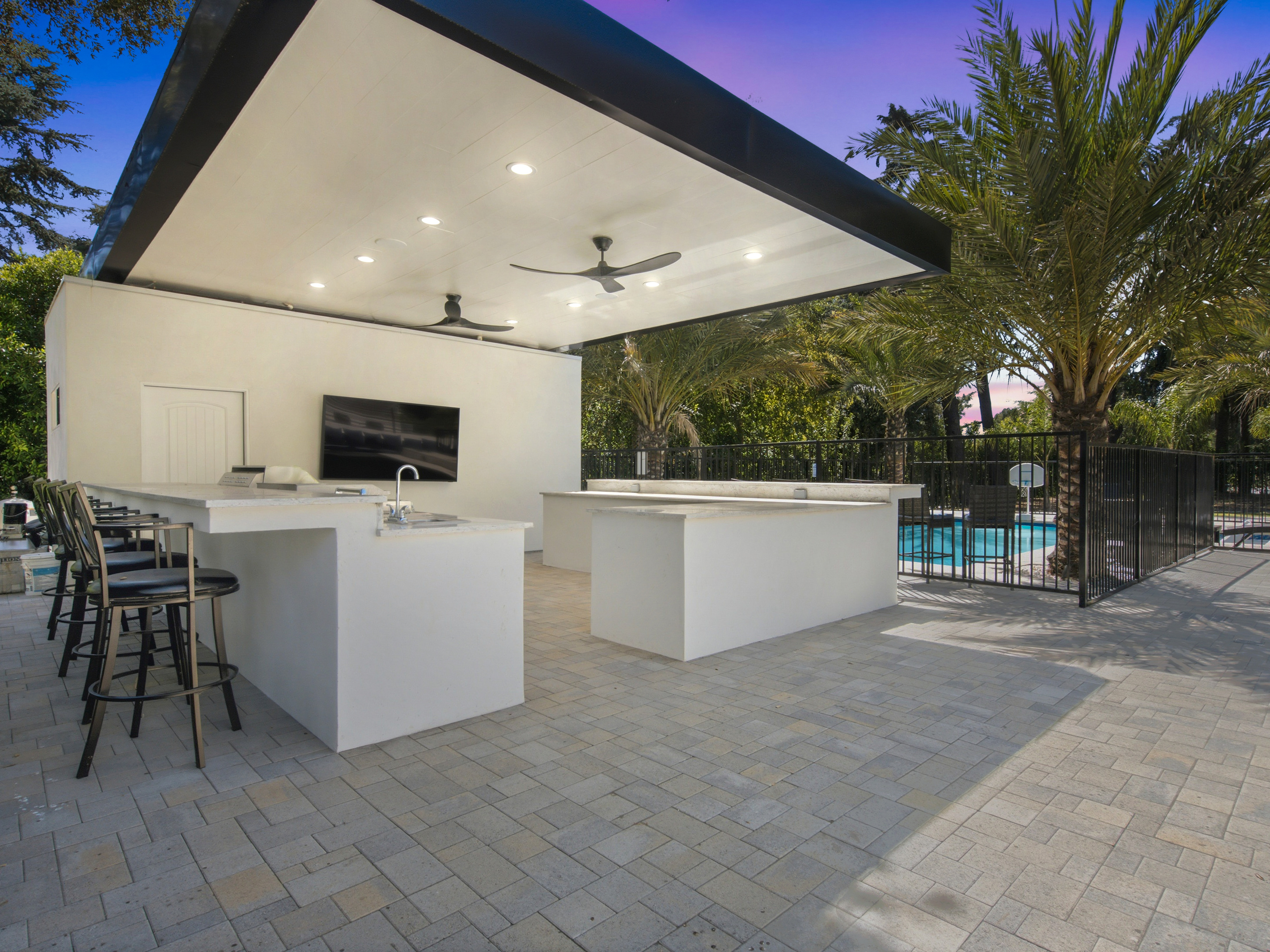 Opens directly into the bright dining space, offering ample seating and peaceful views of the outdoors.