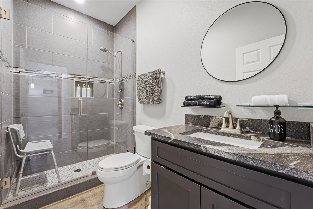 Second full bathroom with toiletries, hair dryer, and essentials