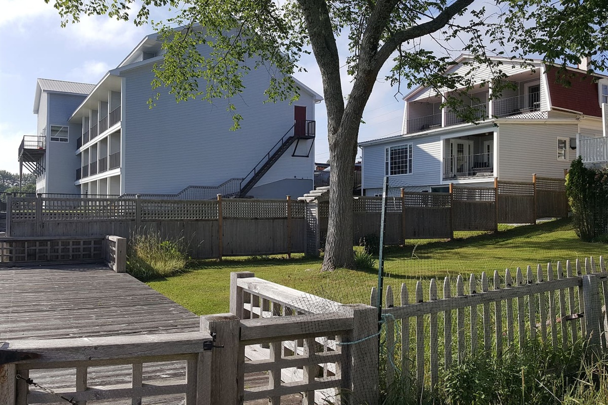 View of the back of the house with private yard and 4 private balcony's.