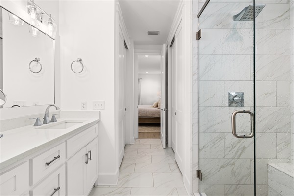 Enjoy a spacious walk-in shower, perfect for rinsing off after beach days and poolside afternoons.