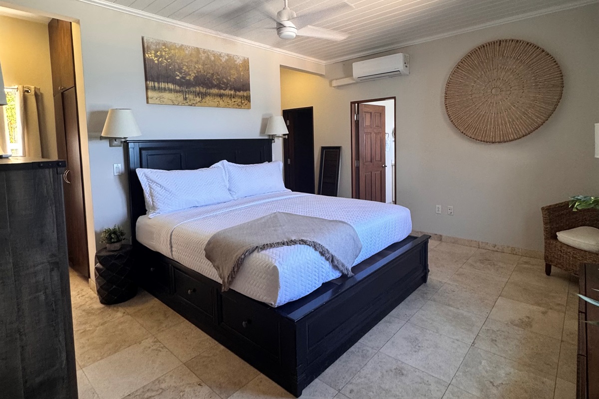 Relax in the king primary suite with elegant furnishings and calming Caribbean style.