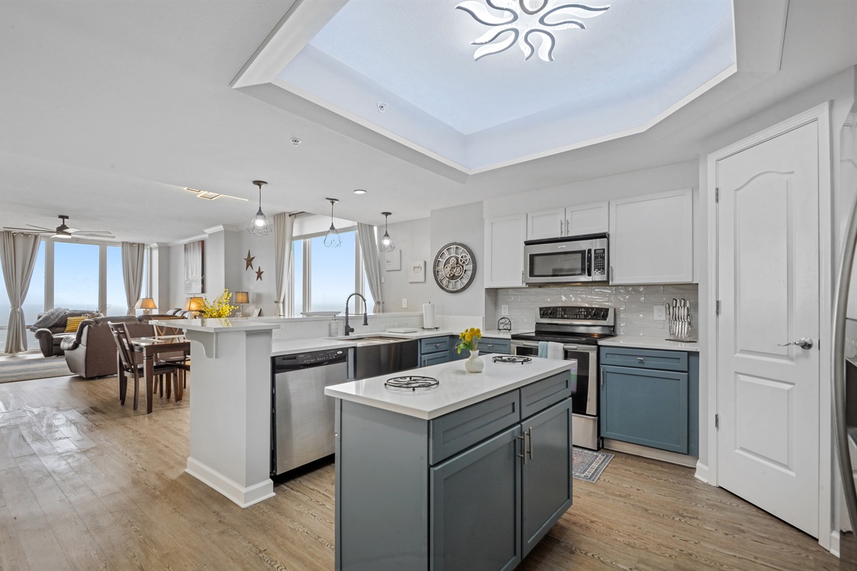 Kitchen open to dining and living and floor to ceiling Gulf views.