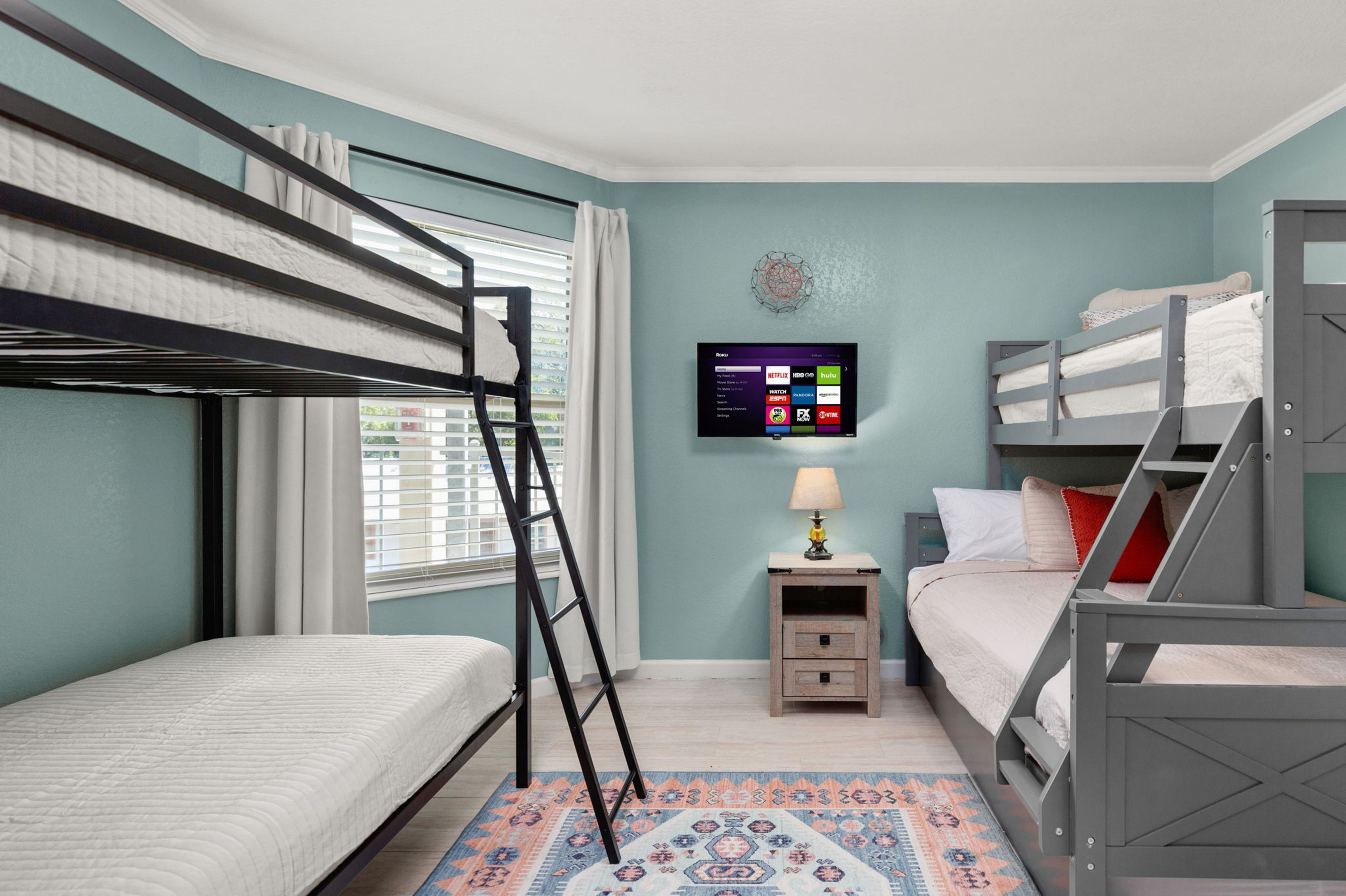Guest bedroom with multiple sleeping configurations.