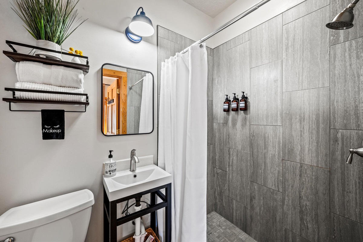 The bathroom with tile walk in shower is spotless. Our cleaners are amazing!