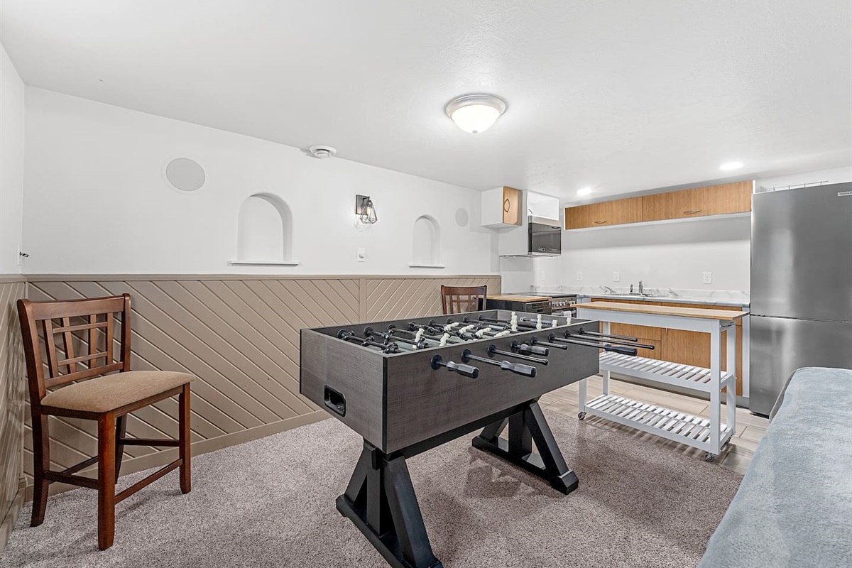 Lower level Foosball Table and Kitchen. 