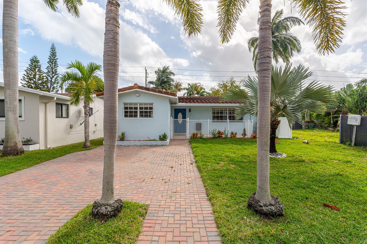 Beautiful 4 bedroom, 3 bathroom pool home in a family-friendly, safe neighborhood. Features a wide paver driveway, tropical palms, and welcoming curb appeal.