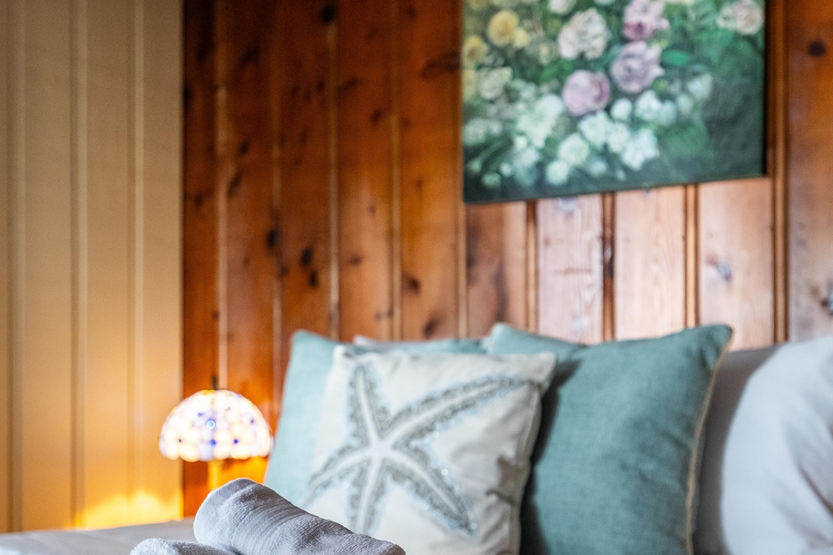 Rustic queen bedroom charm balanced with modern details.