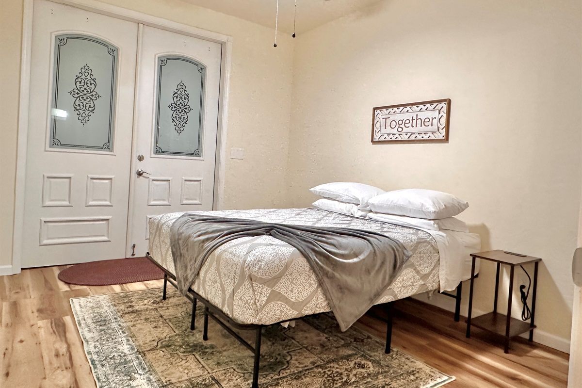 Queen bed with direct access to the pond.