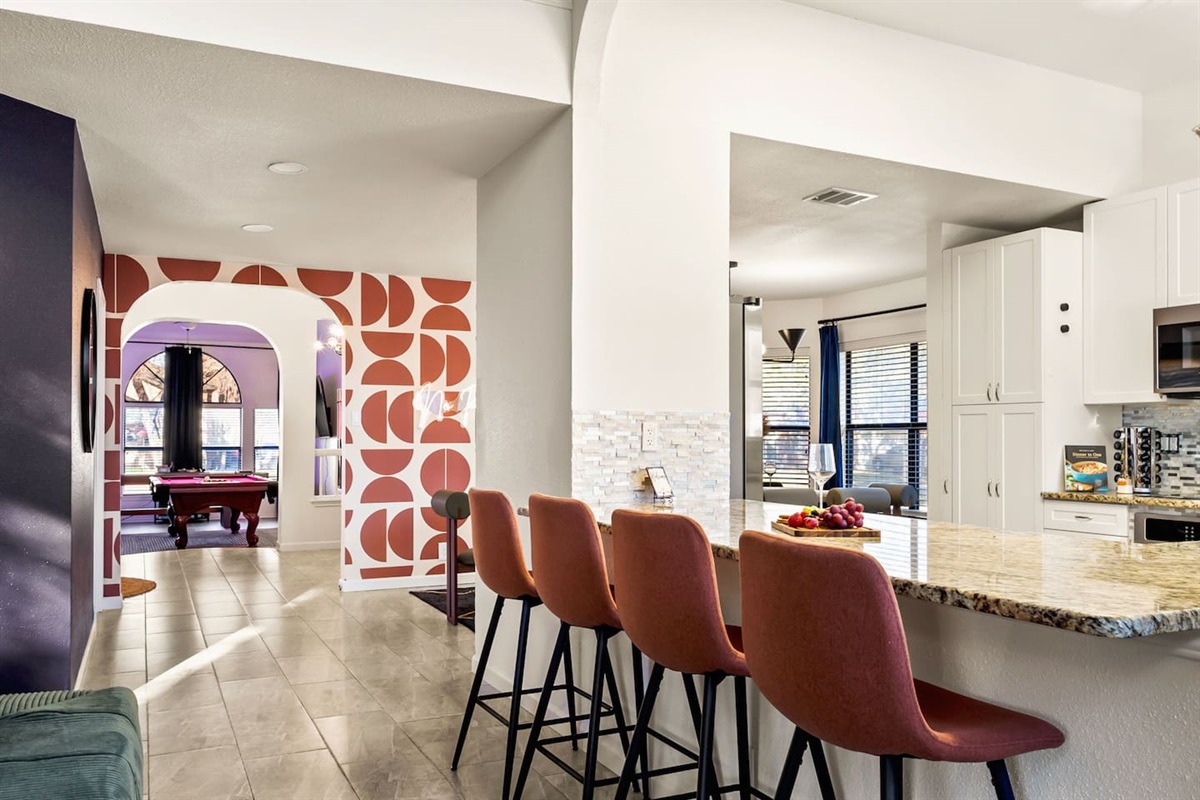 Gather your crew around the  kitchen island before heading to the game room for some friendly competition. This open-concept layout blends modern style with comfort—perfect for groups looking to relax, recharge, and make lasting memories.