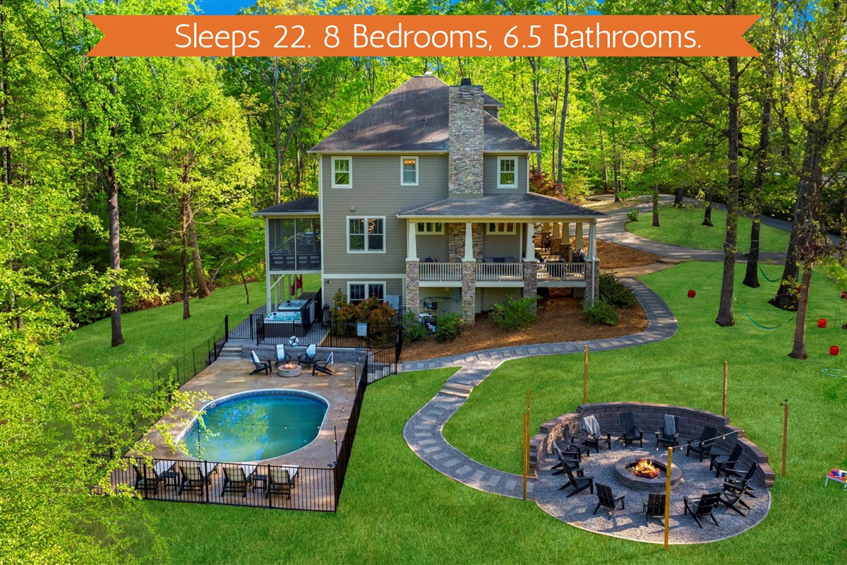 Tucked into the forest with seasonal mountain views, this luxury 8-bedroom retreat sleeps 22 and features a private pool, massive fire pit, hot tubs, outdoor games, a game room, 2 kitchens, 6 king bedrooms & 5 ensuite bathrooms just outside Asheville NC.