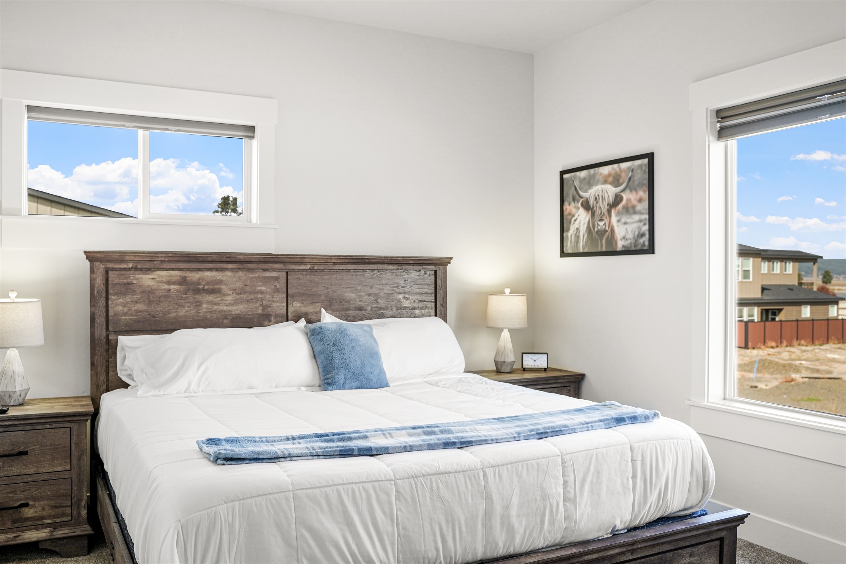 Spacious and bright bedroom with king-sized bed and rustic style.