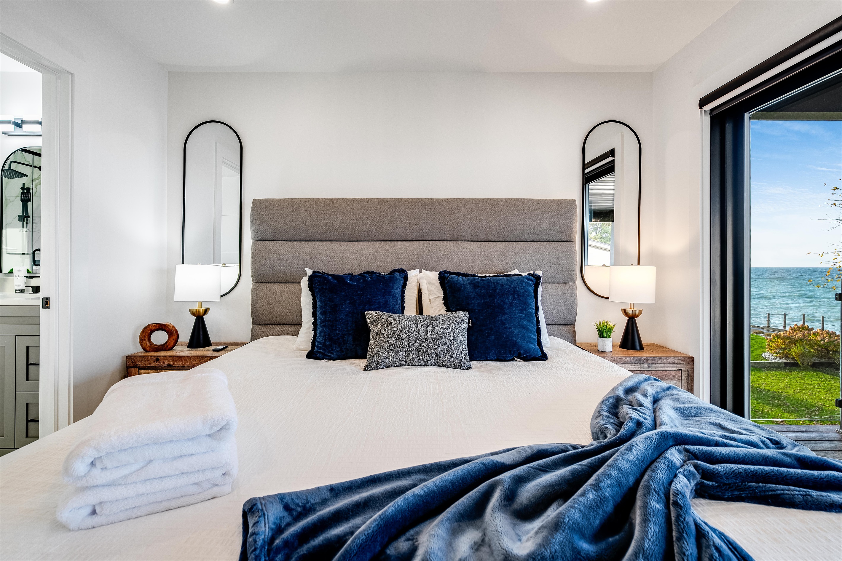 King Bedroom with Layered textures add warmth to the modern palette.