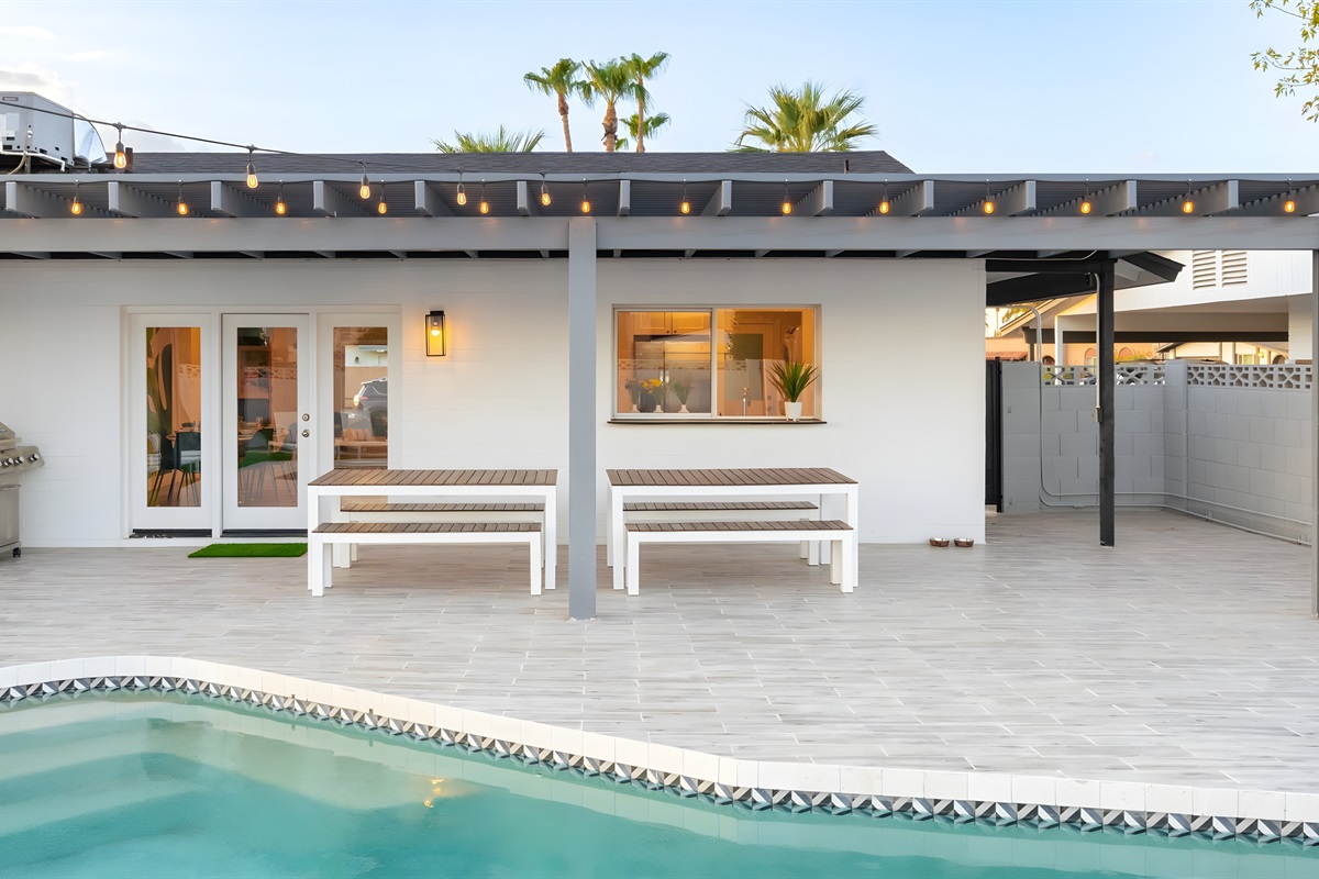 Fire up the gas grill and enjoy some shade under the pergola