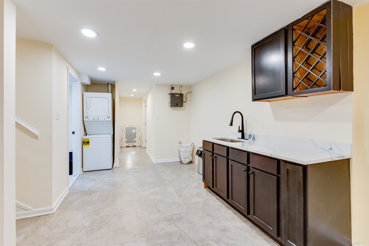 Laundry Area: Enjoy a modern space with sleek cabinetry and convenient appliances at your fingertips!