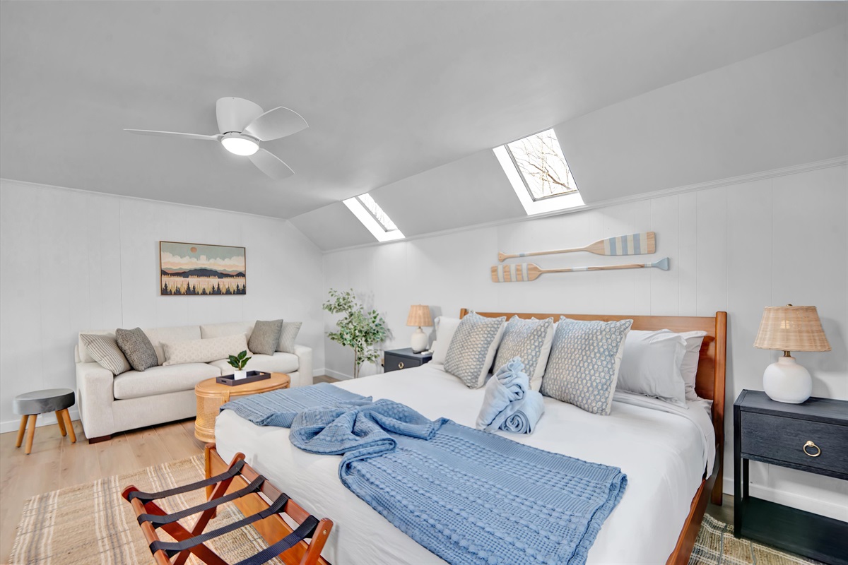 King suite with plush linens and calm vibes.