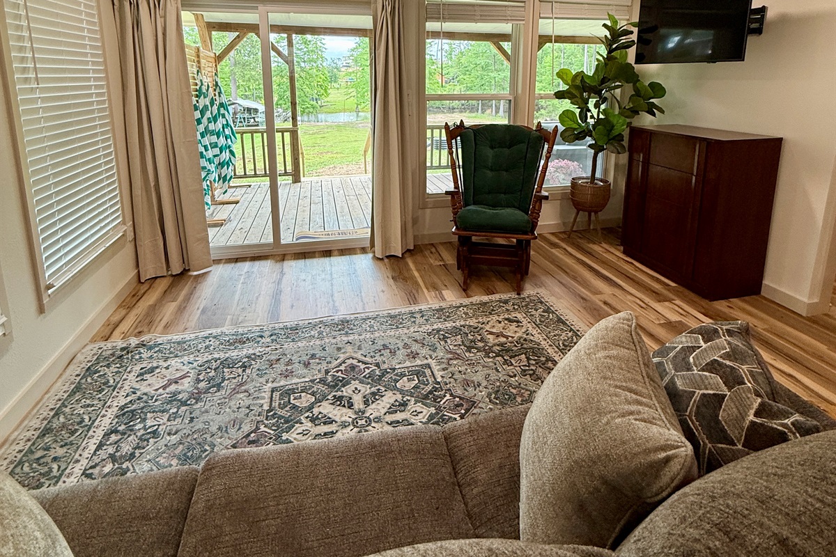 Relax in the living room with a bird's eye view of the lake!