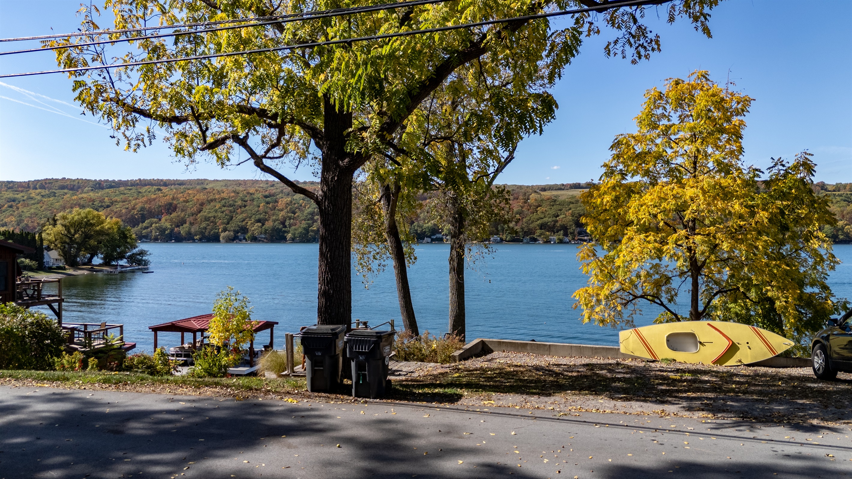 Expansive lake views framed by tall trees — unwind beneath the canopy and take in the Finger Lakes magic