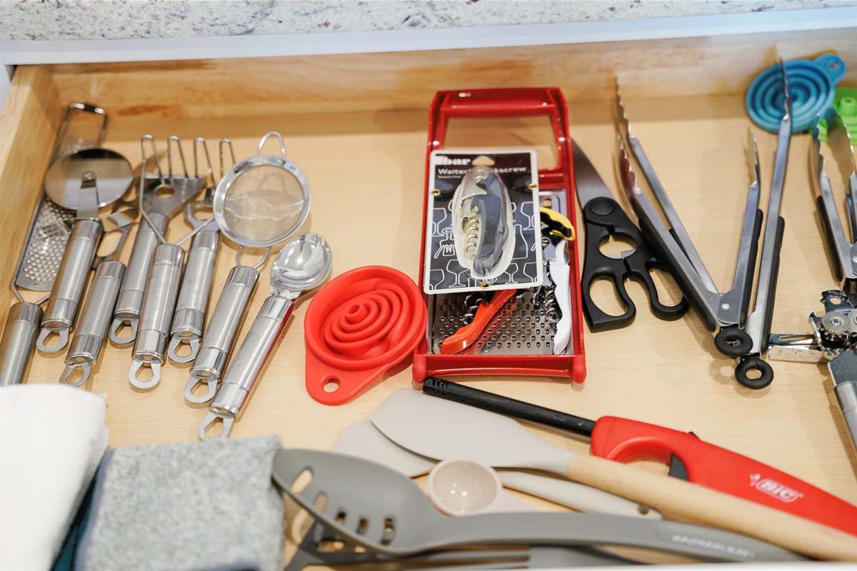 Complete kitchen setup with pots, pans, and utensils for home-style cooking