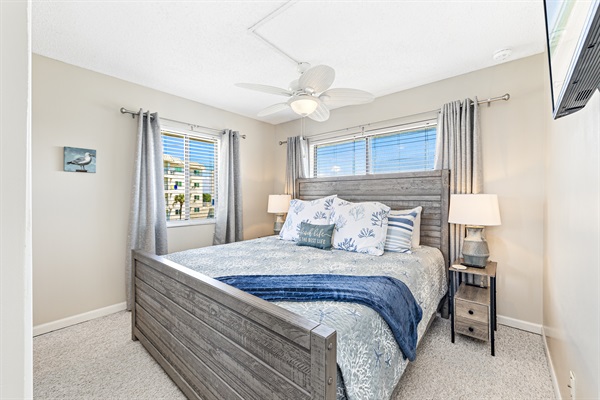 Primary bedroom with King sized bed, smart TV, closet and private full sized bathroom.