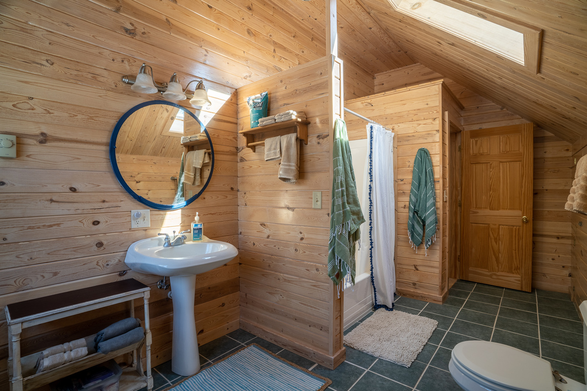 The upstairs bathroom is huge!  Has a full-size bathtub, shower and single vanity.