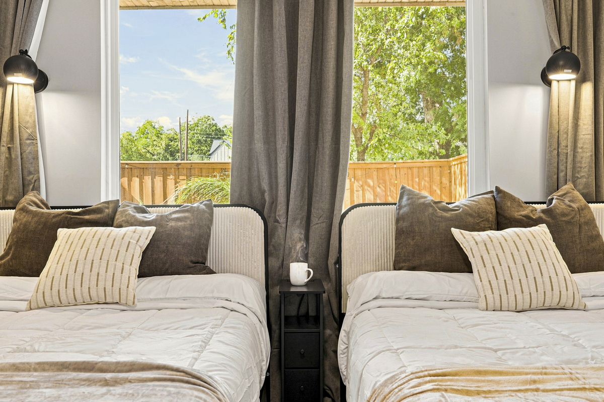 Relax in style with twin beds, elegant decor, and serene views of nature!