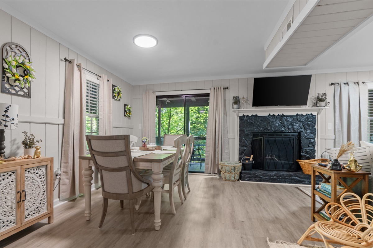 Dining area, living room, and access to the back deck