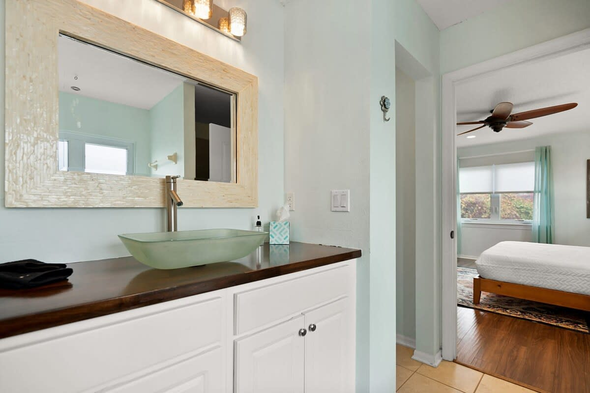 A double vanity with two vessel basins and mirrors, so nobody is left queueing to clean their teeth. Small practicalities like this are what make a big group holiday feel relaxed rather than logistical.