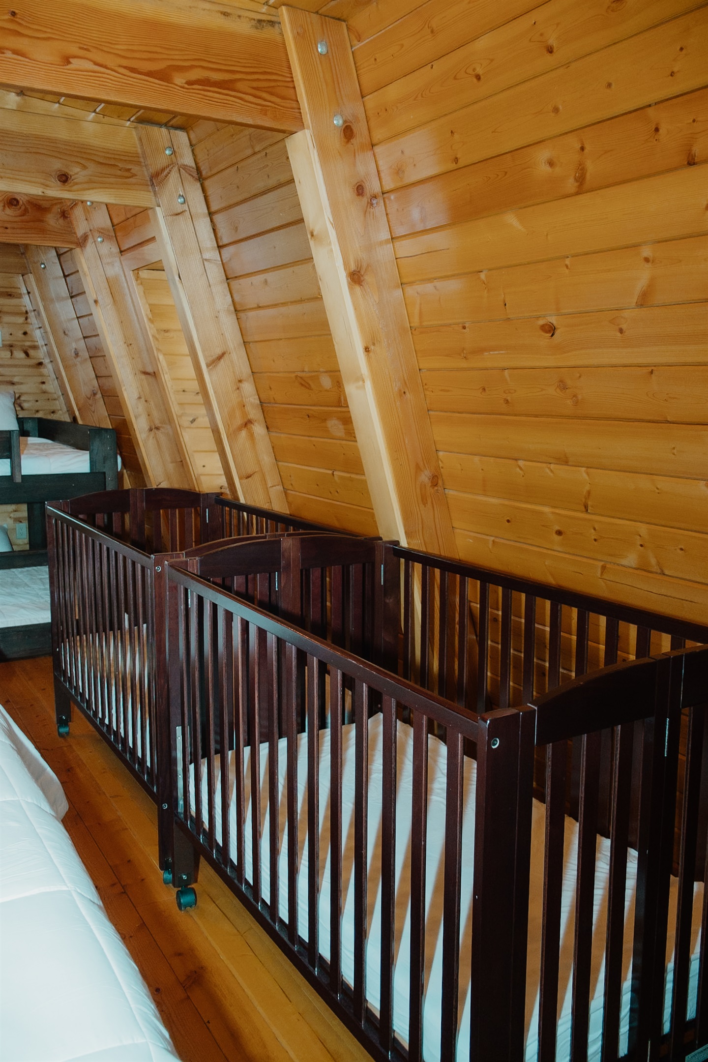 Two full-size cribs with mattresses and sheets available at no extra charge—just let us know!