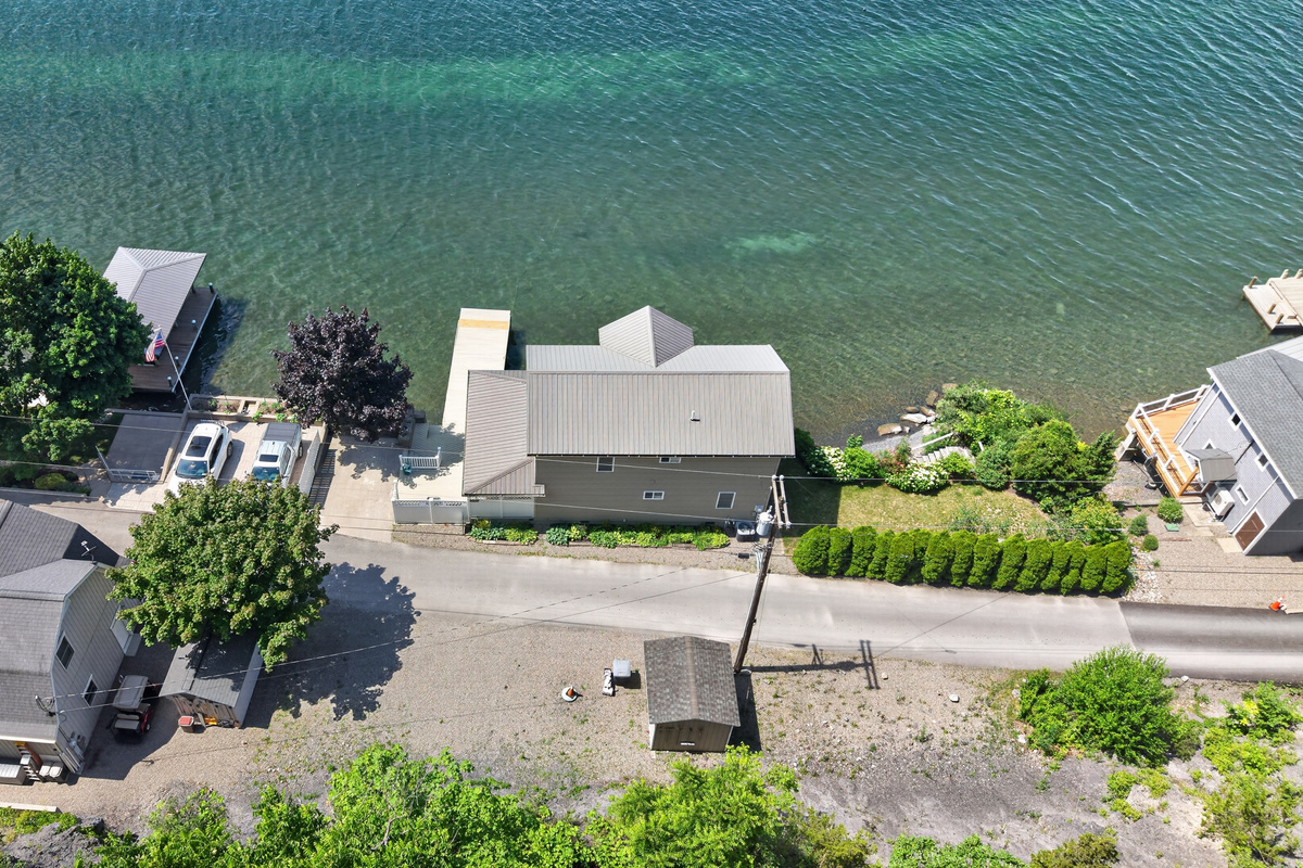 Lakeside buildings positioned along the rocky shore