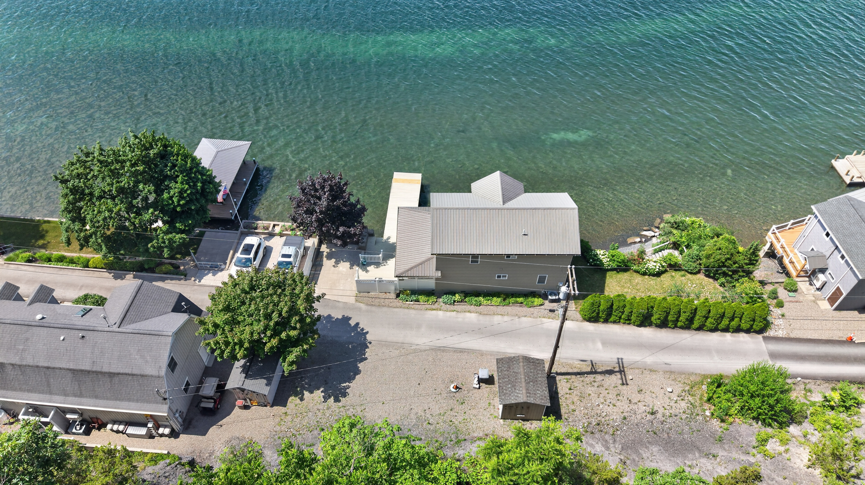 Lakeside buildings positioned along the rocky shore