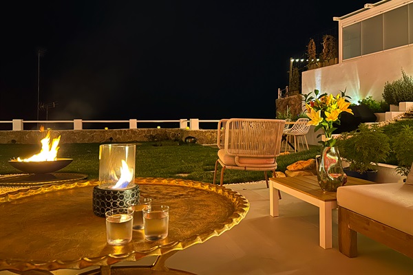 Set the stage for a private evening of romance in Casa Folimanka's garden. The dark sea, a bright bioethanol flame, and a fire pit on an isolated surface create a magical ambiance. Immerse yourself in the enchantment, accompanied by the soothing melodies.