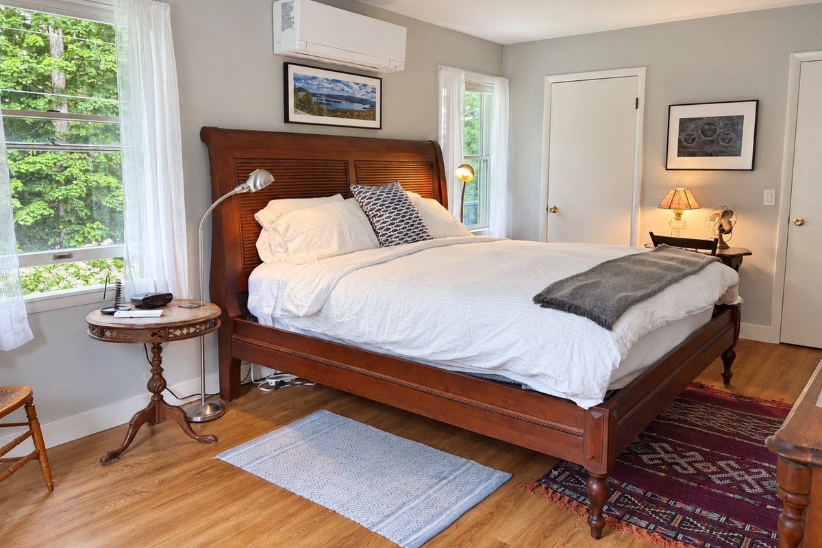 King bed with an adjoining half bath.